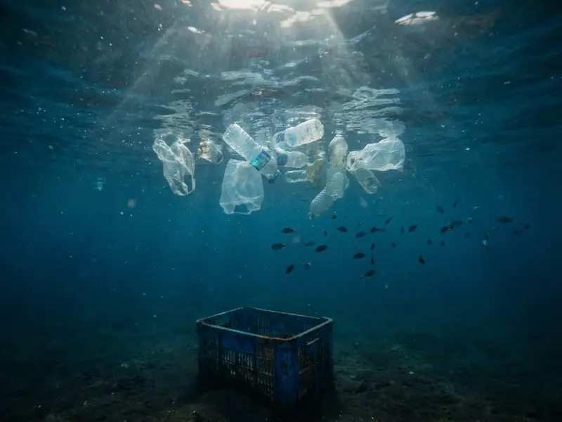 Ocean plastic waste illustrating why alternative coating end-of-life paths are under R&D.