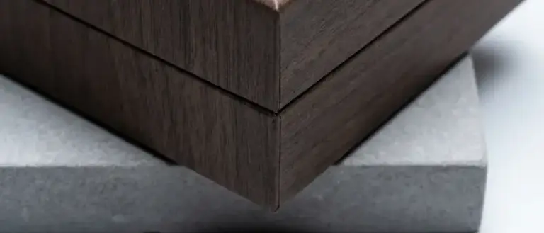 Luxury rigid box with decorative wood-grain wrap showing clean seam control and non-staining adhesive bonding.