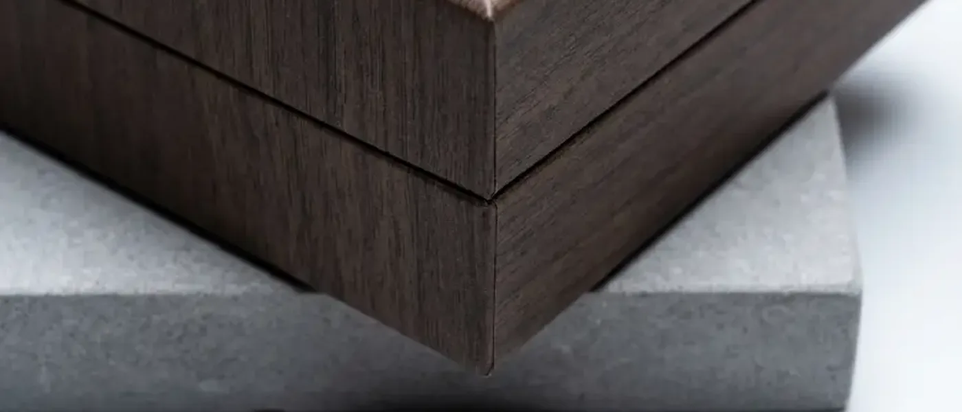 Luxury rigid box with decorative wood-grain wrap showing clean seam control and non-staining adhesive bonding.