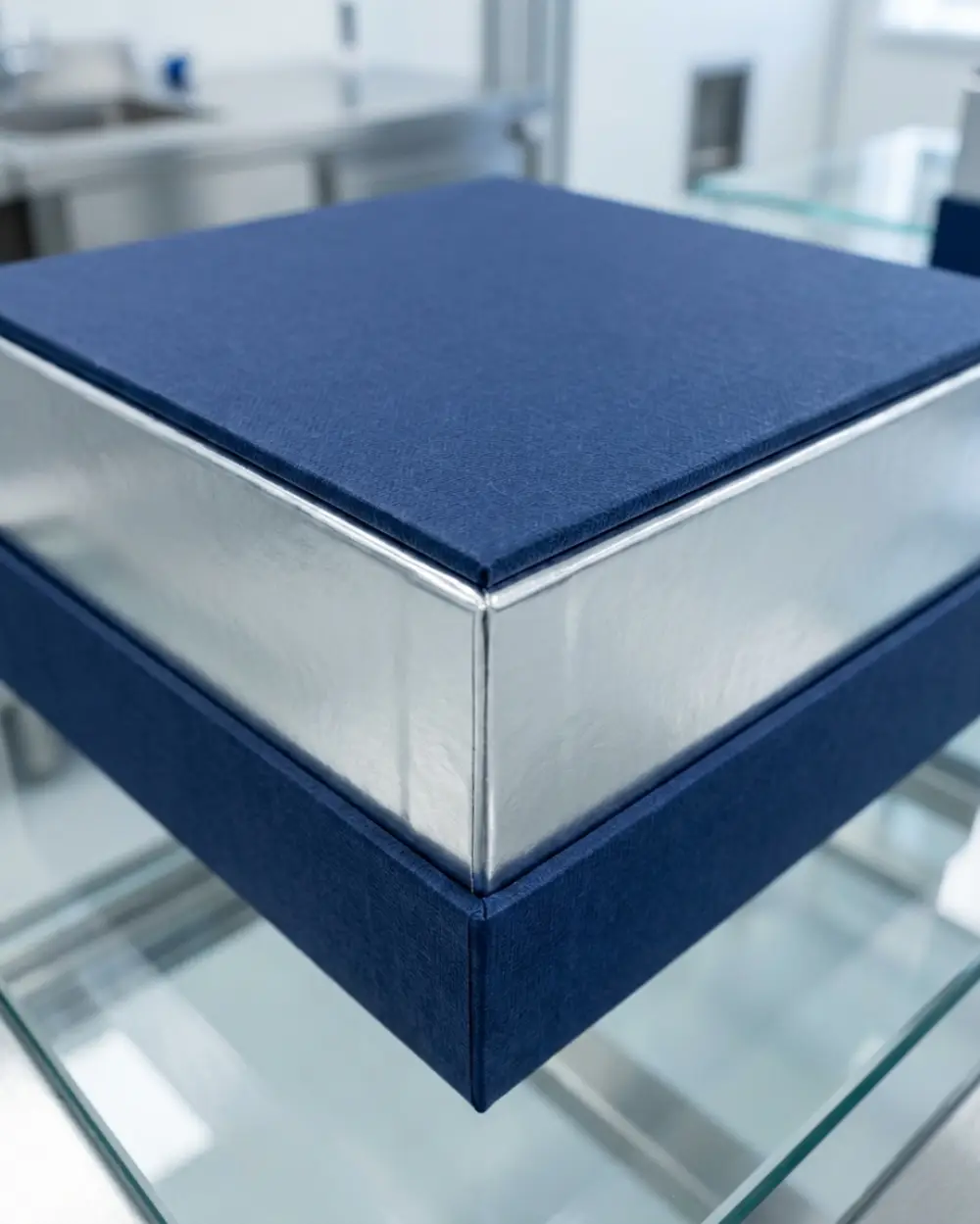 Luxury composite canister with foil bonding demonstrating clean decorative wrap seam control.