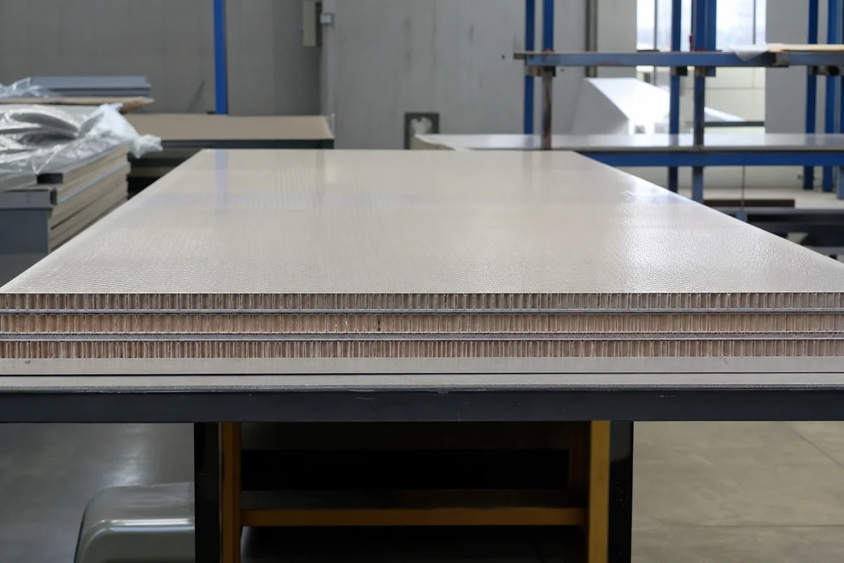 Perfectly flat honeycomb structural panel after anti-curling lamination qualification.