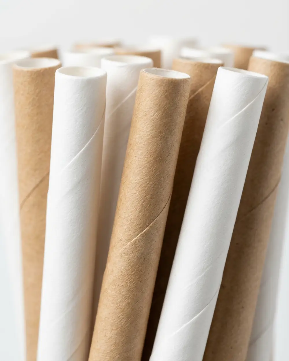Close view of spiral-wound paper straw structure showing why adhesive quality controls delamination and collapse.