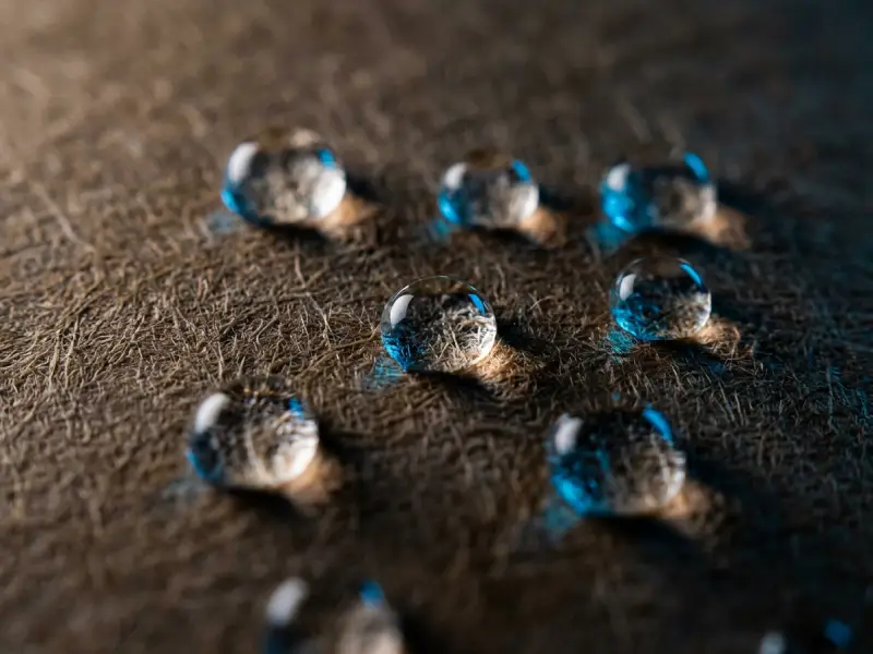 Water barrier holdout on coated paper packaging sample.